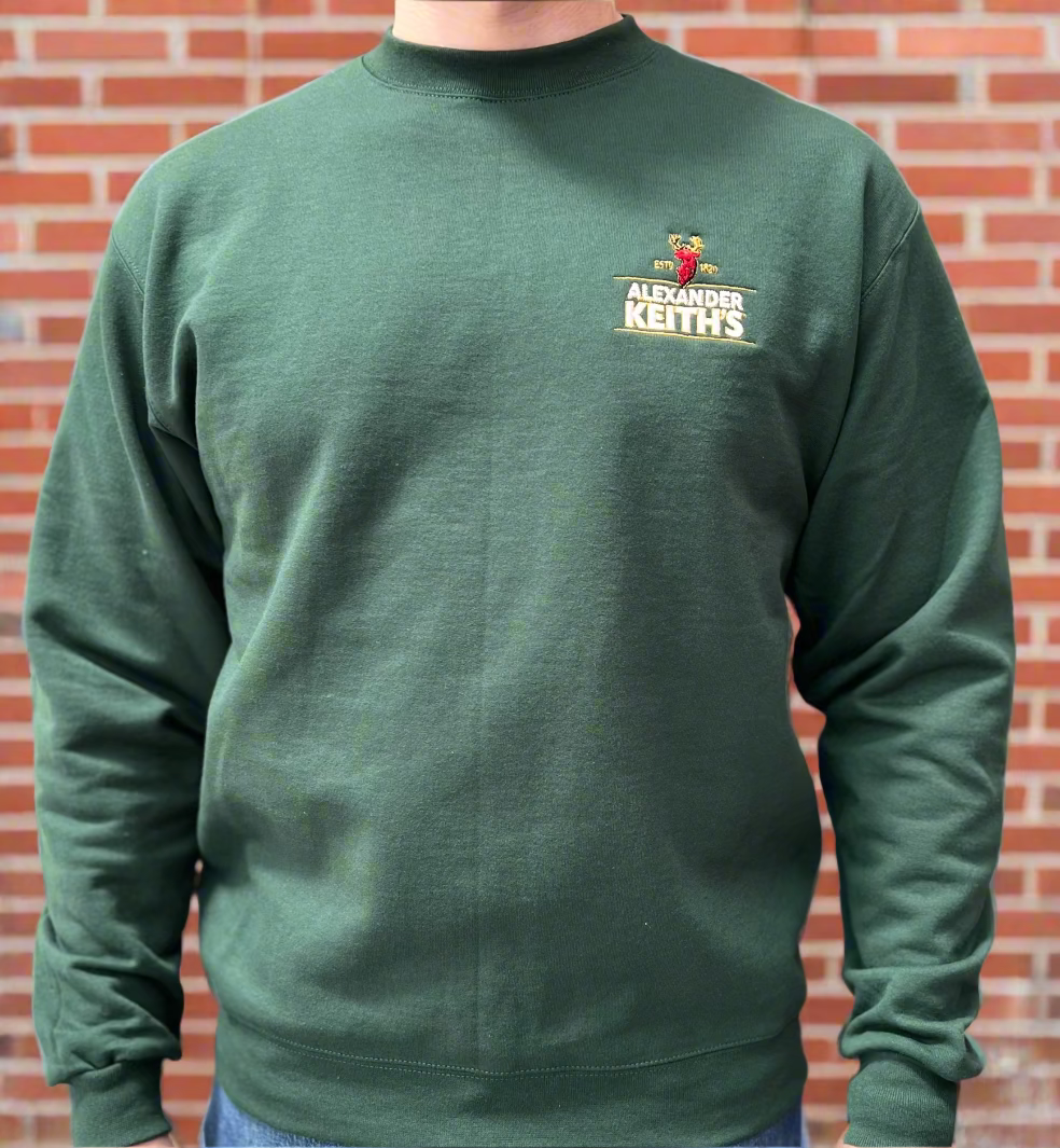 A green crewneck sweater with the Alexander Keith's logo embroidered on the chest.